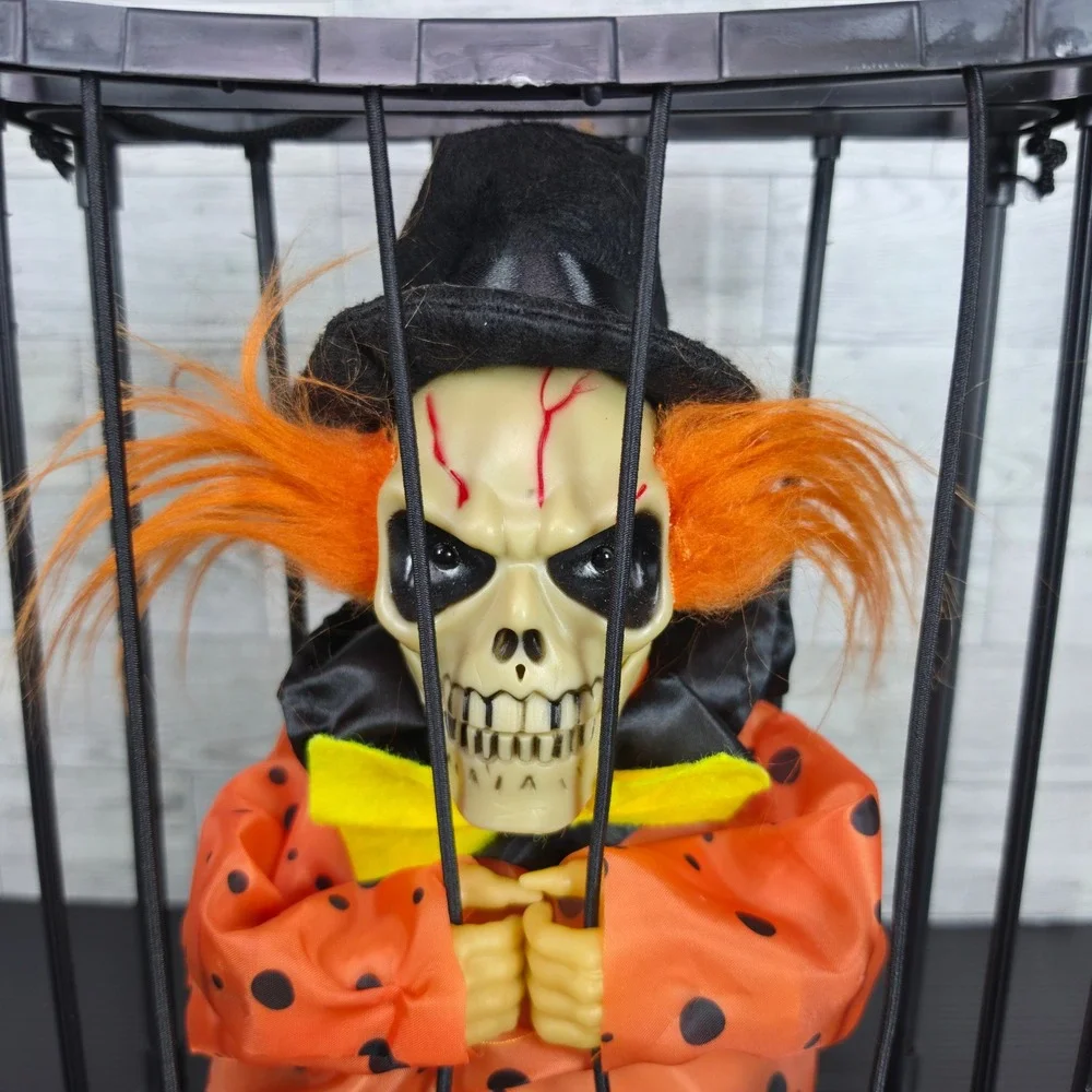 Halloween Animated Skeleton Clown in Cage Hanging Prop Orange Black Skull Decor